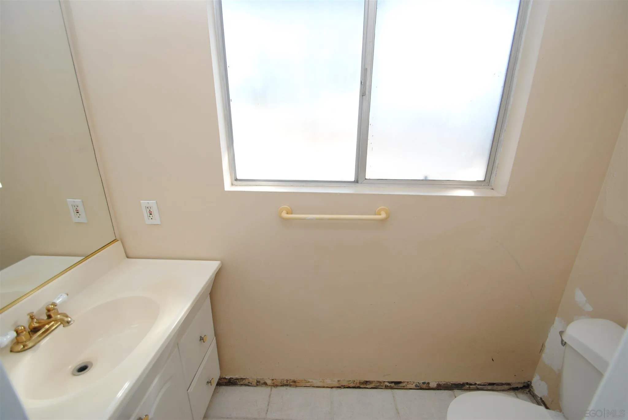 4826 New Ranch Road El Cajon, CA 92020 - Photo 15 of 19 a bathroom with a sink and a toilet
