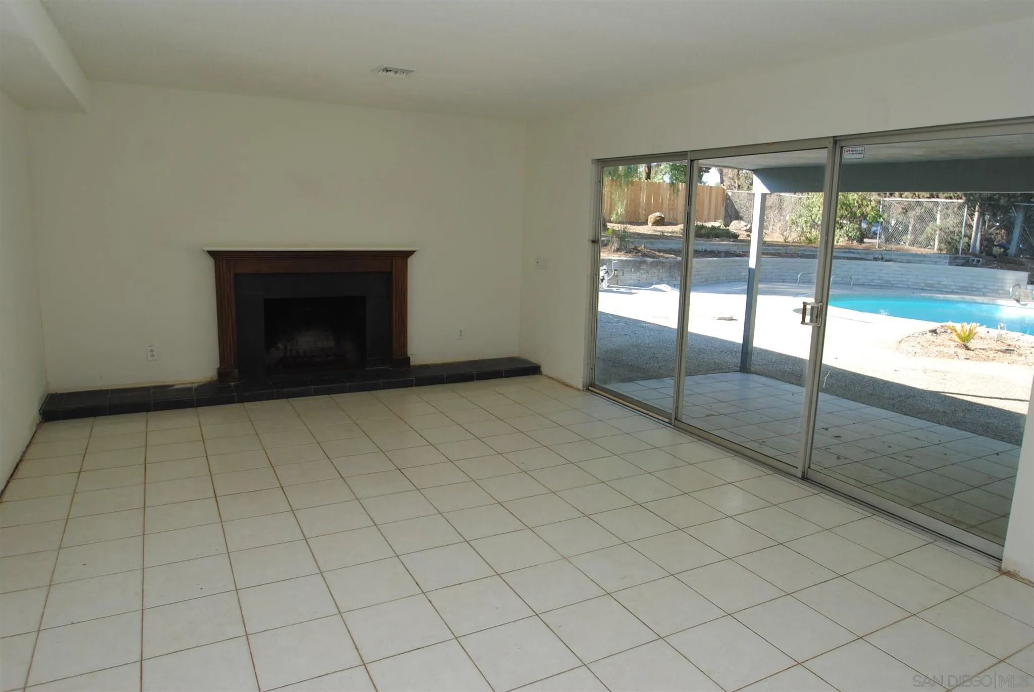 4826 New Ranch Road El Cajon, CA 92020 - Photo 4 of 19 an empty room with sliding door