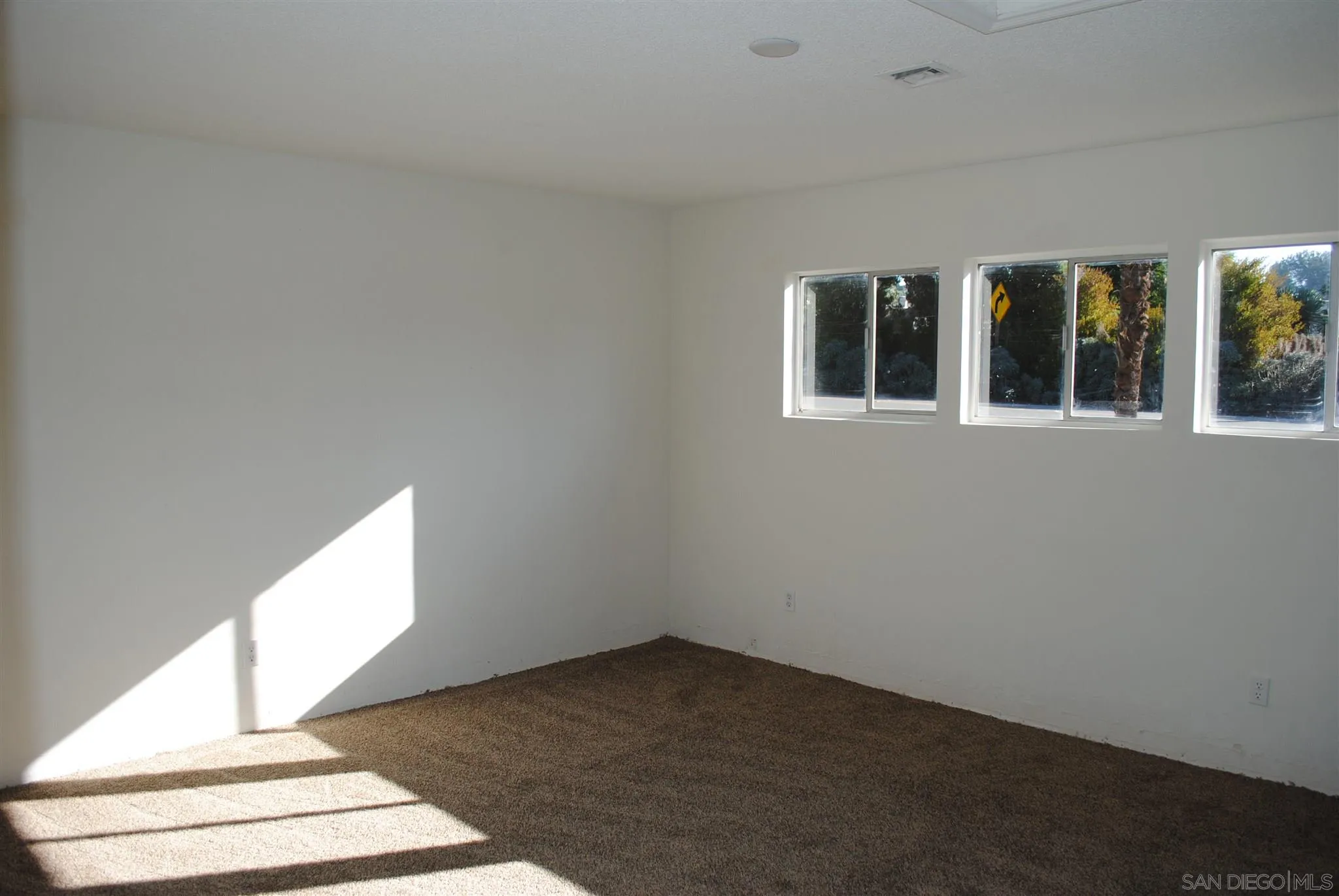 4826 New Ranch Road El Cajon, CA 92020 - Photo 9 of 19 a view of an empty room with windows