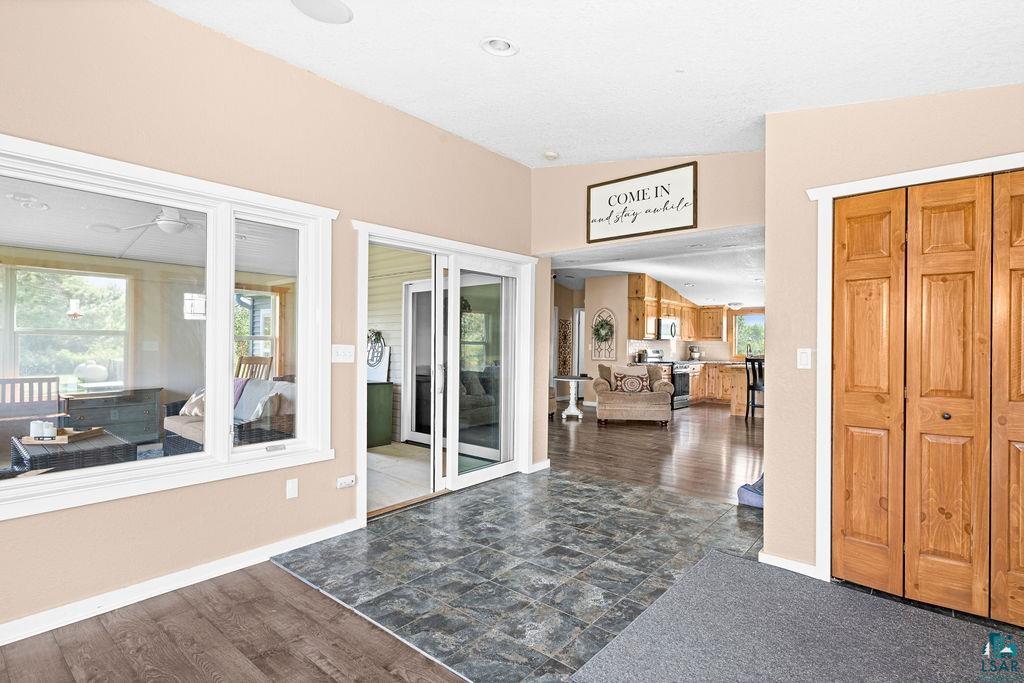 6638 Tabako Road Wright, MN 55798 - Photo 5 of 34 Interior space featuring vaulted ceiling and dark wood finished floors