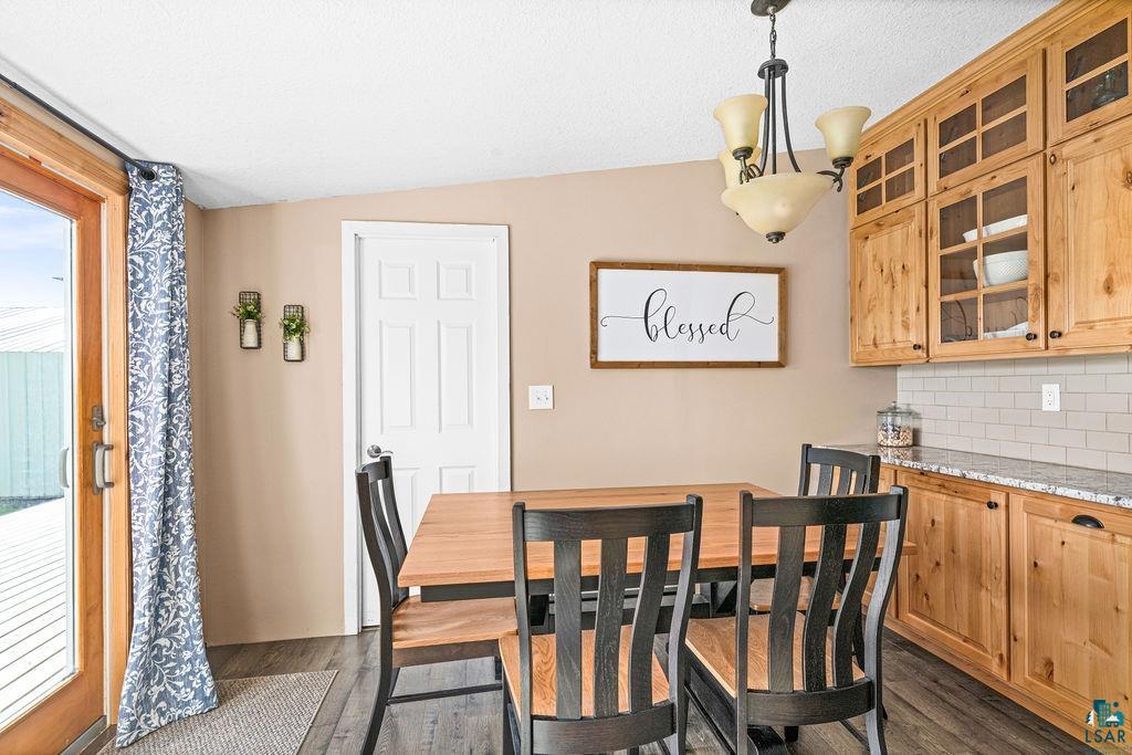 6638 Tabako Road Wright, MN 55798 - Photo 10 of 34 Dining area featuring dark wood finished floors