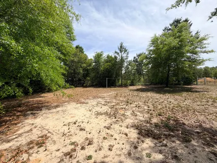a view of wooden floor and a yard
