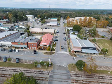 an aerial view of residential houses with outdoor space