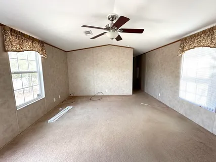 a view of an empty room with a window