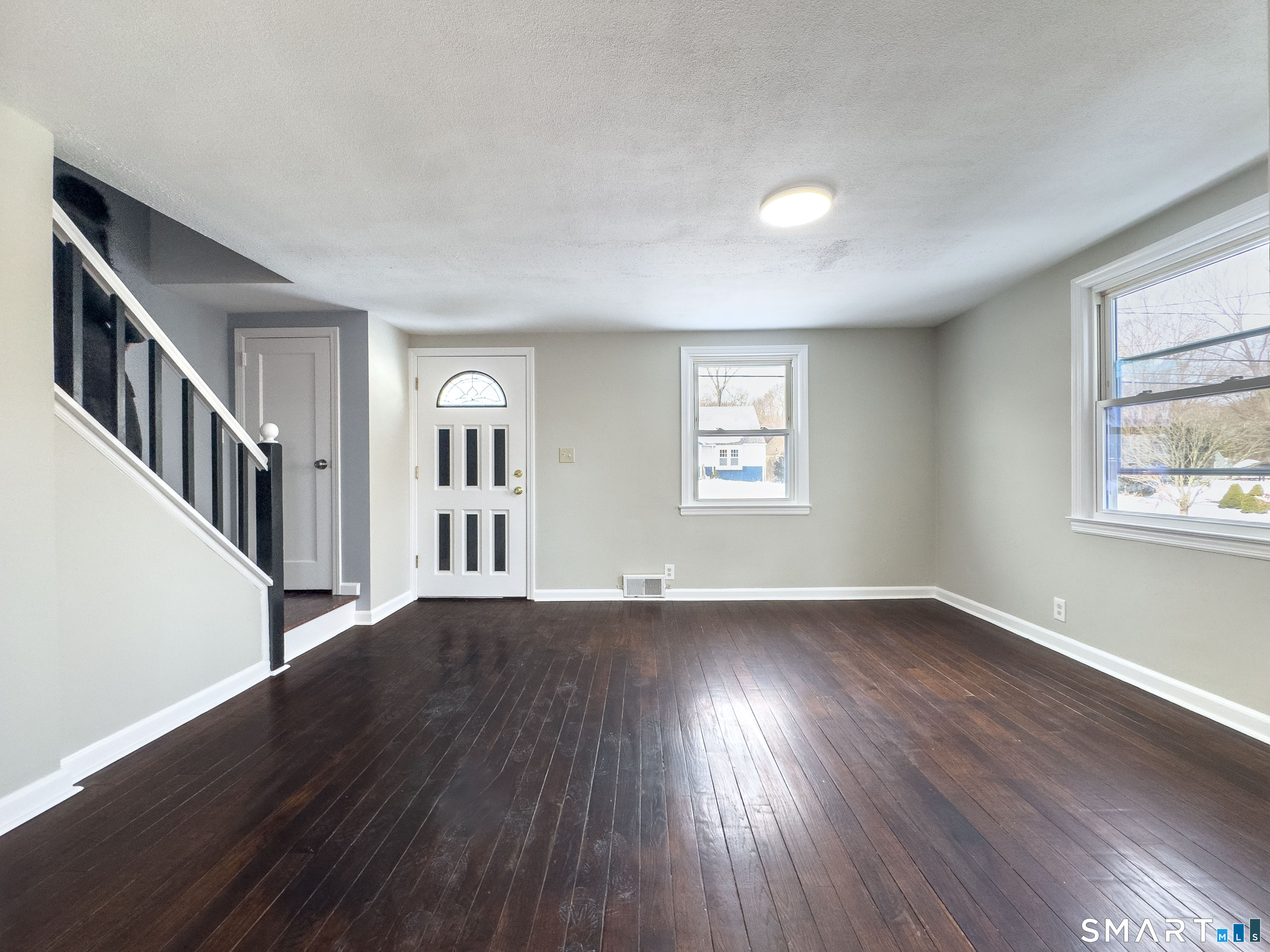 167 North Hoadley Street Naugatuck, CT 06770 - Photo 3 of 17 a view of an empty room with wooden floor and a window