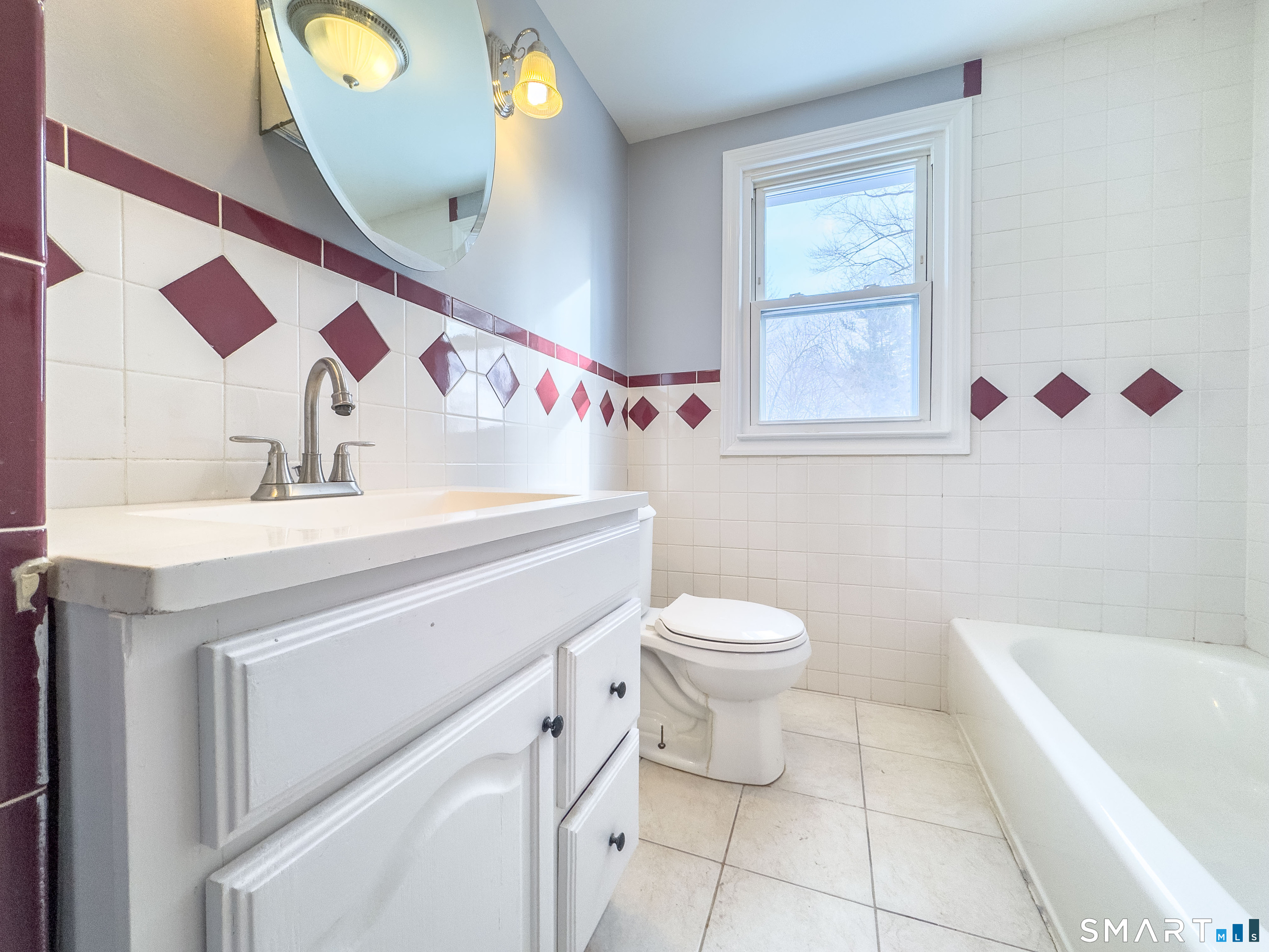 167 North Hoadley Street Naugatuck, CT 06770 - Photo 7 of 17 a bathroom with a sink a vanity and a mirror