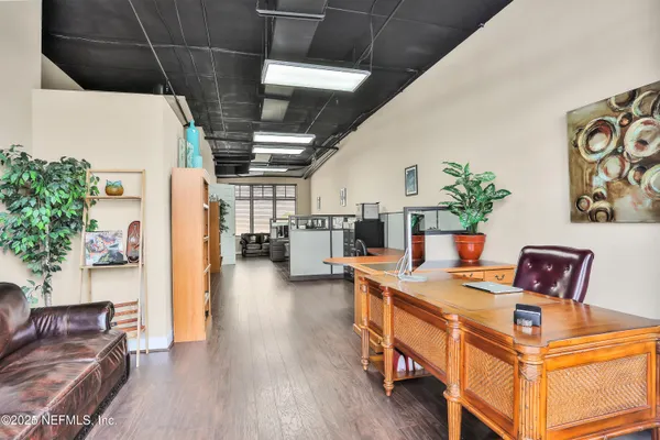a living room with furniture and a table