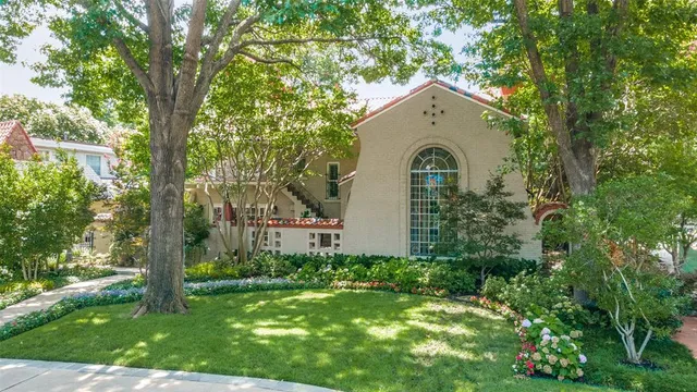 a house with a tree in front of the house