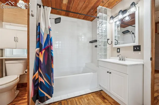 a bathroom with a bathtub and a shower