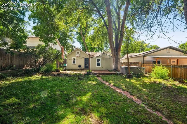 a view of a yard with a house and garden