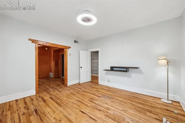 a view of a kitchen with wooden floor