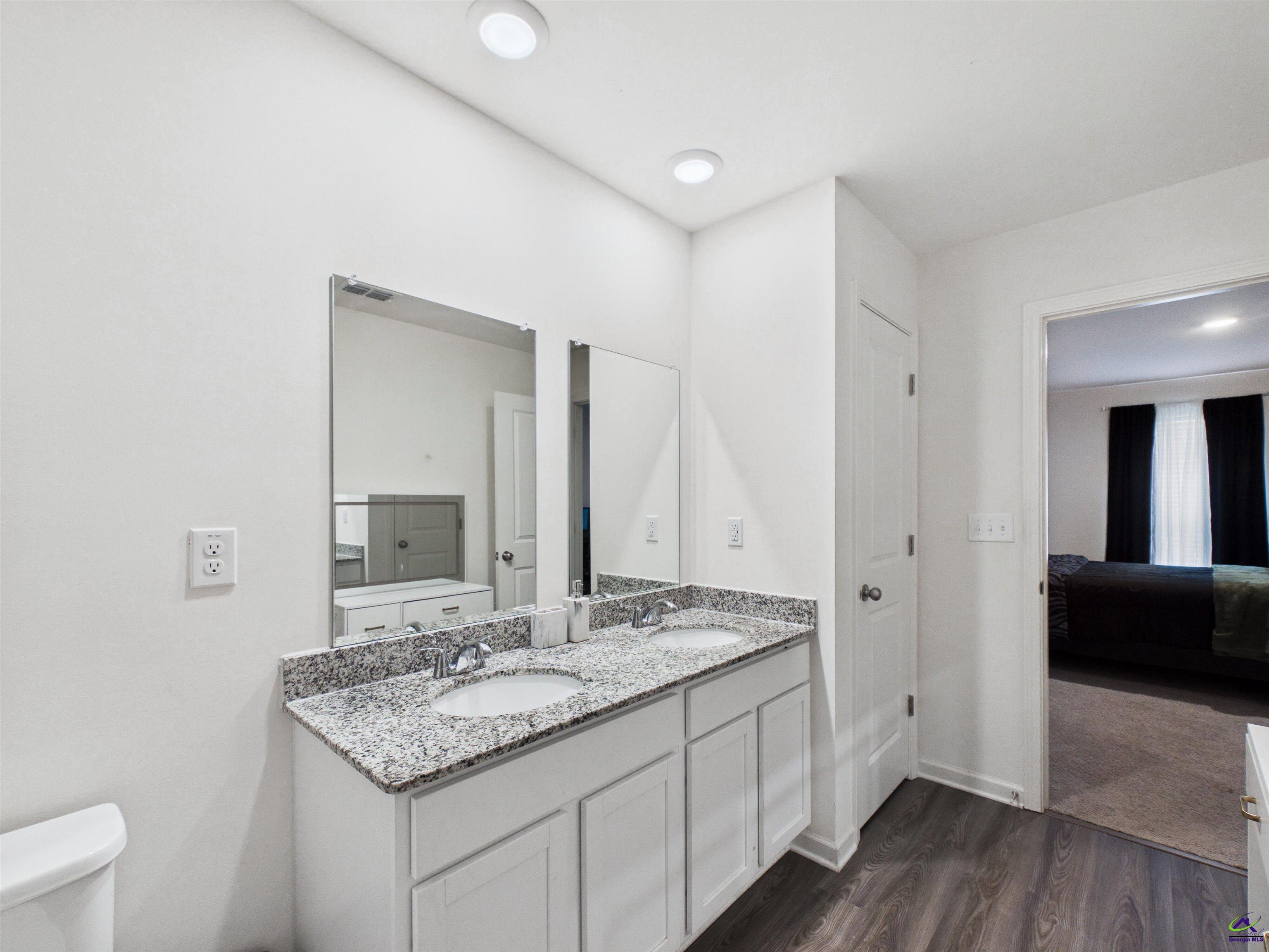 116 Jamie Court Fort Valley, GA 31030 - Photo 12 of 19 a bathroom with a granite countertop sink and a mirror
