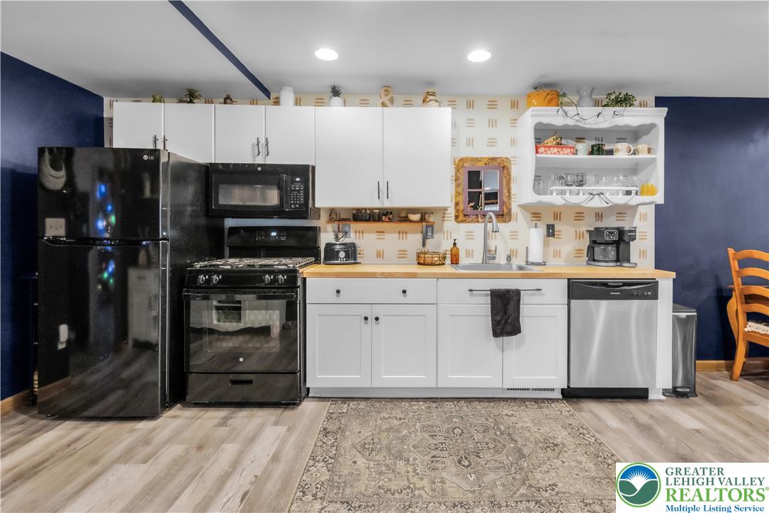 2031 Wayne Street Bethlehem, PA 18020 - Photo 13 of 36 a kitchen with stainless steel appliances a refrigerator sink and microwave