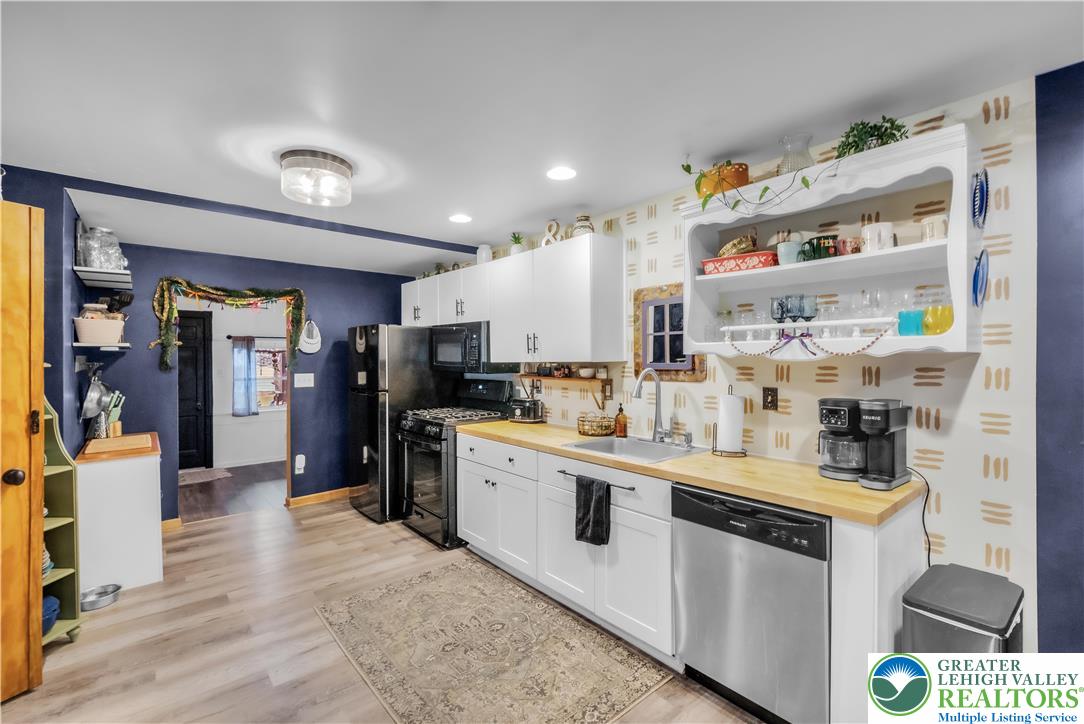 2031 Wayne Street Bethlehem, PA 18020 - Photo 14 of 36 a kitchen with stainless steel appliances granite countertop a refrigerator and a stove top oven