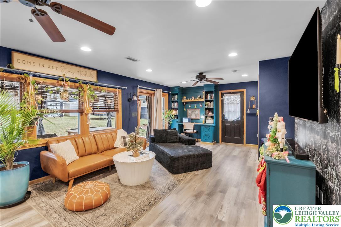 2031 Wayne Street Bethlehem, PA 18020 - Photo 18 of 36 a living room with furniture fireplace and a flat screen tv