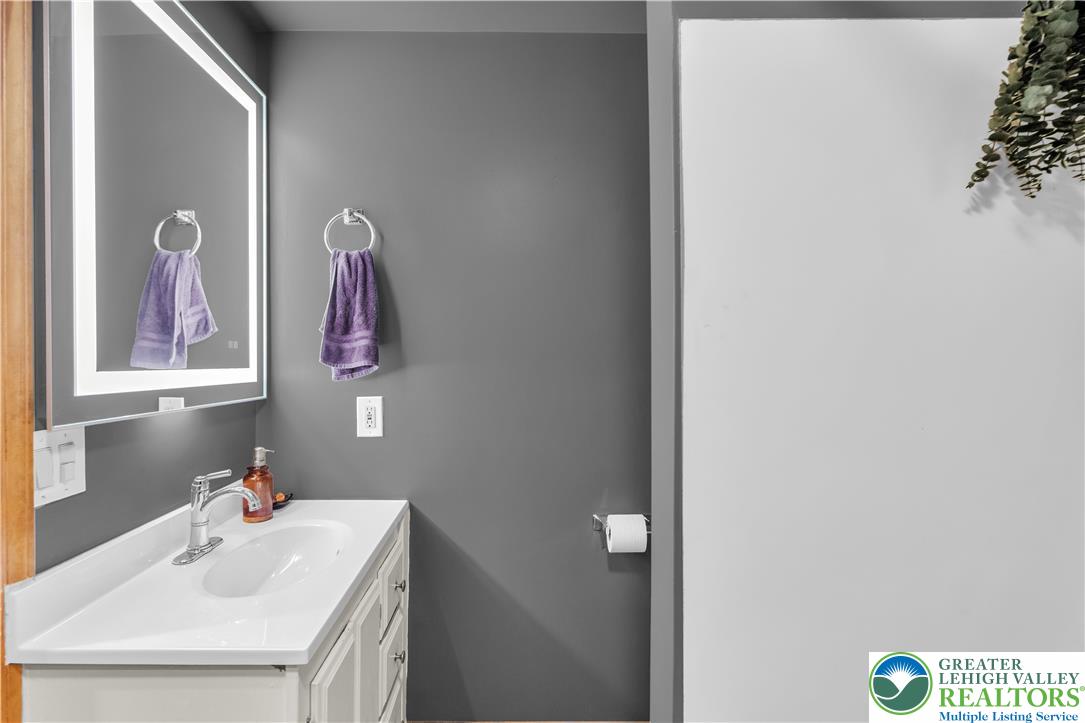 2031 Wayne Street Bethlehem, PA 18020 - Photo 22 of 36 a bathroom with a sink and a mirror