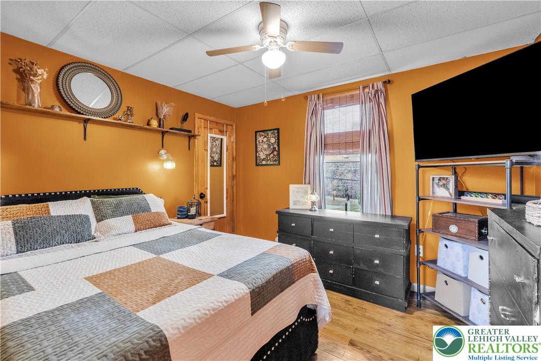 2031 Wayne Street Bethlehem, PA 18020 - Photo 30 of 36 a bedroom with a bed and a flat tv screen on dresser