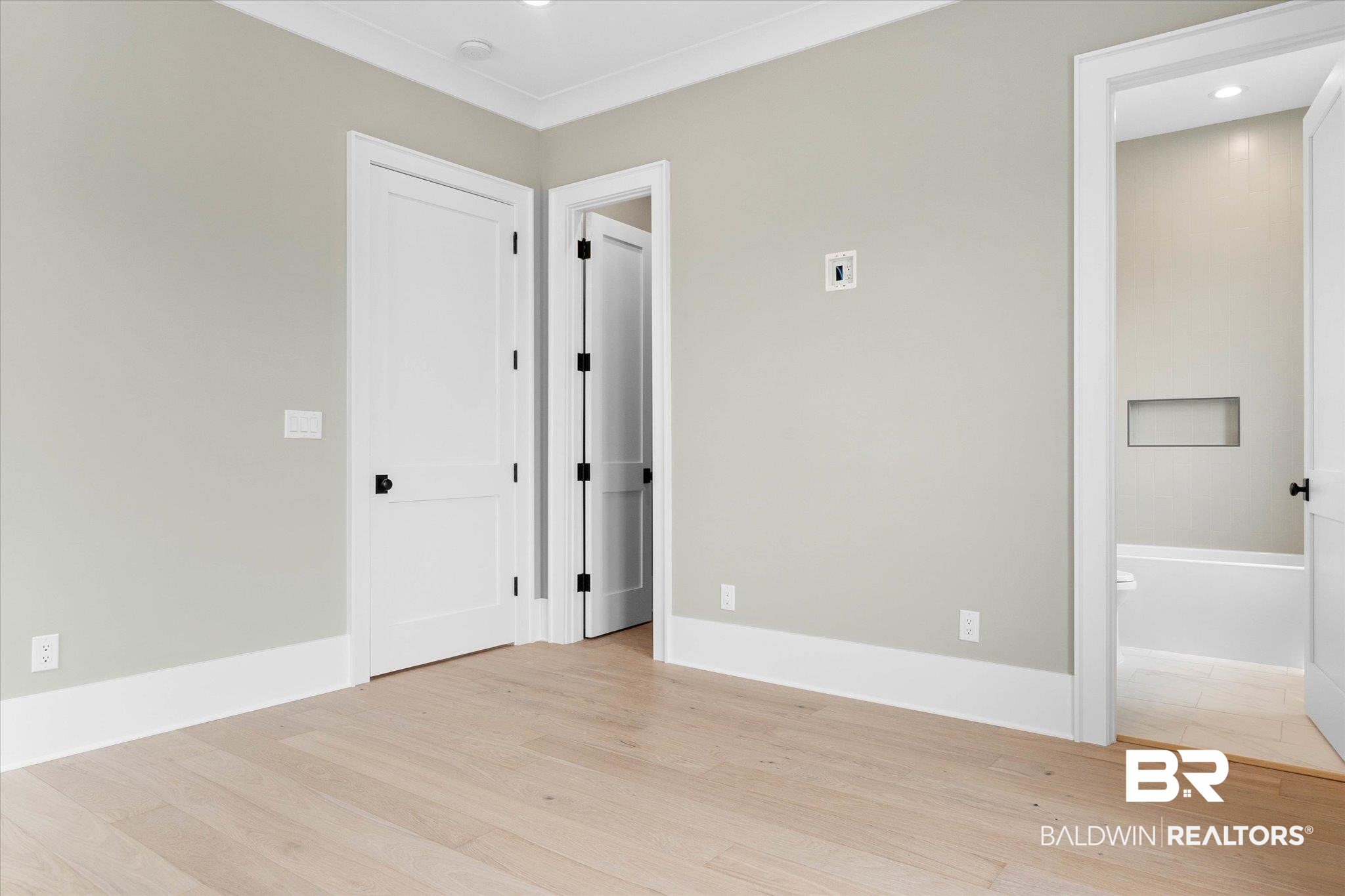 853 Inlet Circle Gulf Shores, AL 36542 - Photo 29 of 55 Empty room with light wood-style floors, recessed lighting, and baseboards