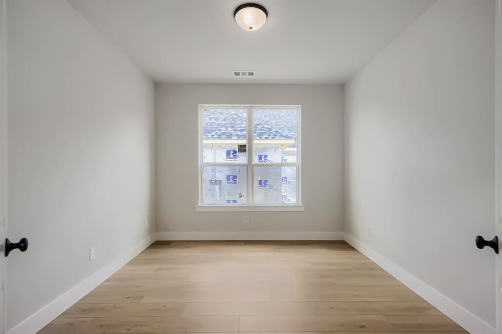 4414 Windy Point Road Oak Point, TX 75068 - Photo 17 of 27 an empty room with a window