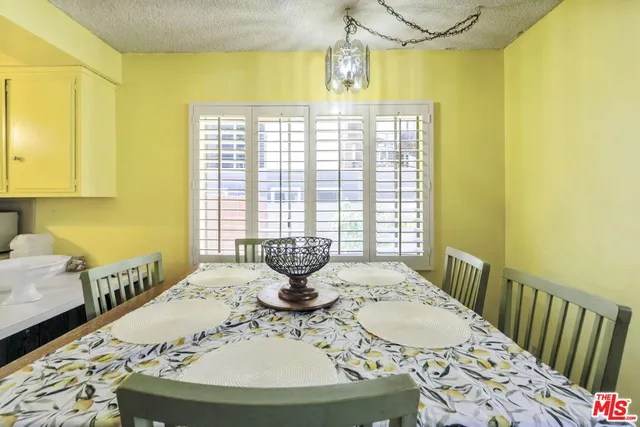 a kitchen with a sink appliances and cabinets