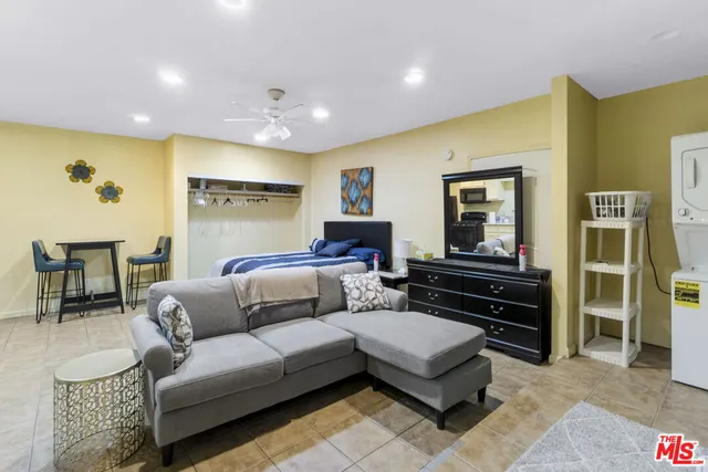 a kitchen with a sink cabinets and window
