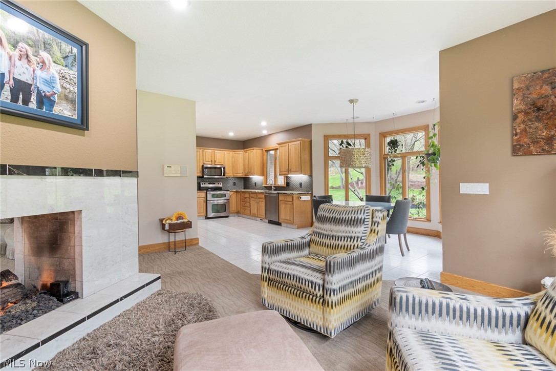 7435 South Raccoon Road Canfield, OH 44406 - Photo 20 of 47 Tiled living room featuring a fireplace