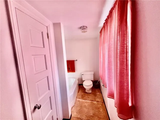 a bathroom with a sink and a shower curtain