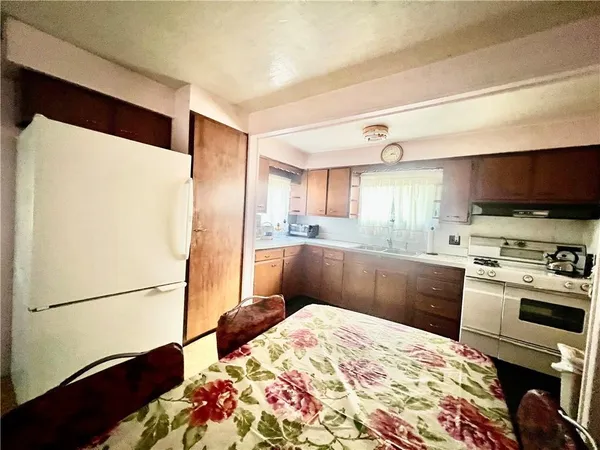 a kitchen with stainless steel appliances granite countertop a refrigerator sink and cabinets