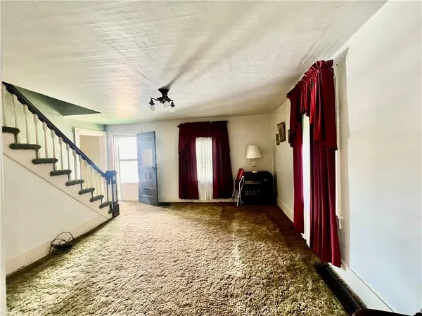 a view of a hallway with a staircase