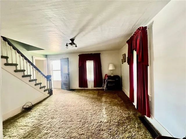 a view of a hallway with a staircase