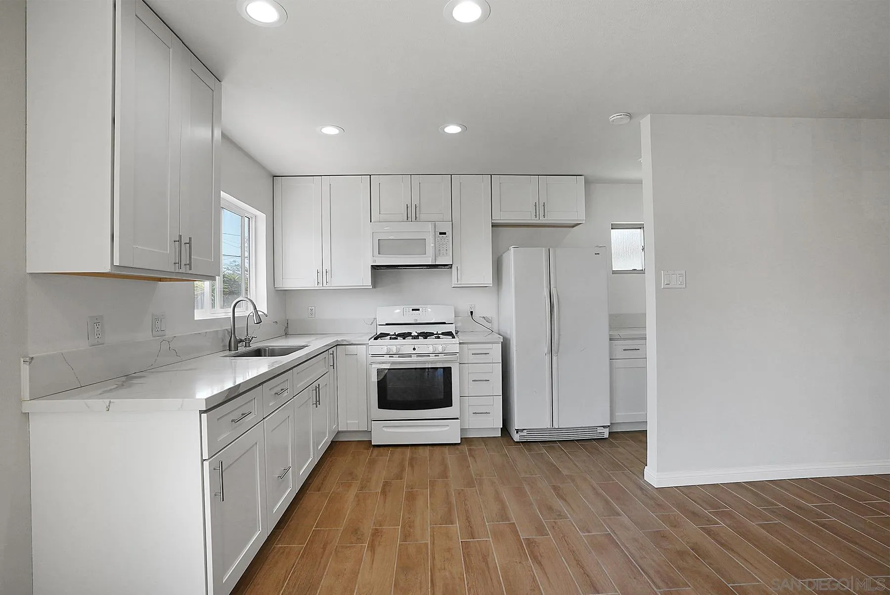 9820 St George Street Spring Valley, CA 91977 - Photo 1 of 23 a kitchen with stainless steel appliances granite countertop a stove a sink and a refrigerator