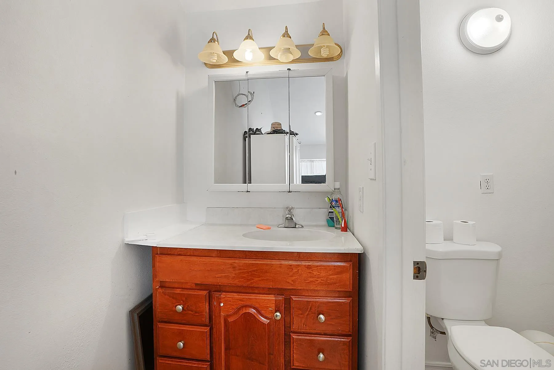 9820 St George Street Spring Valley, CA 91977 - Photo 19 of 23 a bathroom with a sink and a mirror