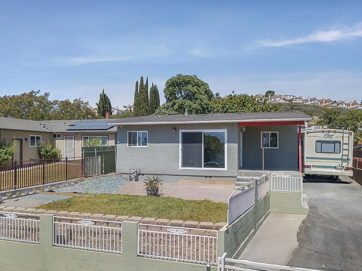 9820 St George Street Spring Valley, CA 91977 - Photo 2 of 23 front view of a house with a yard