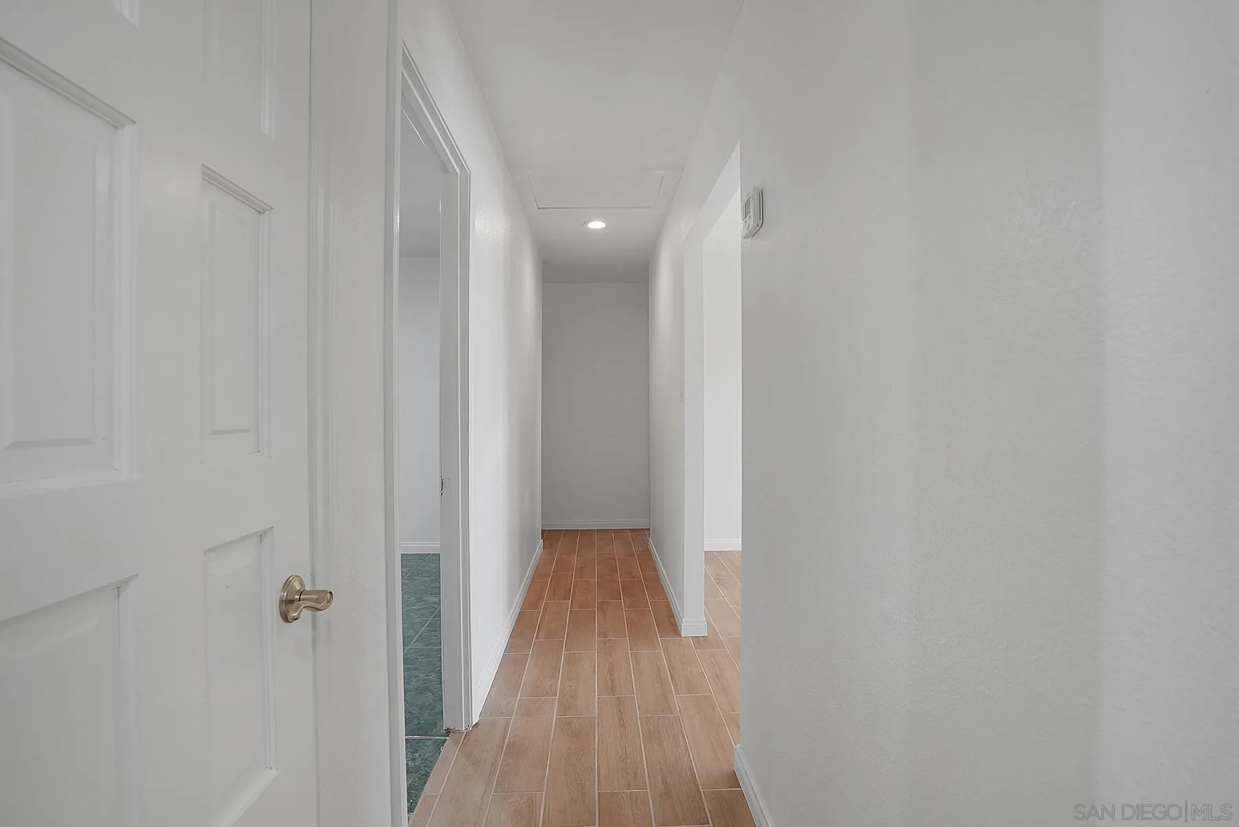 9820 St George Street Spring Valley, CA 91977 - Photo 8 of 23 a view of a hallway with wooden floor