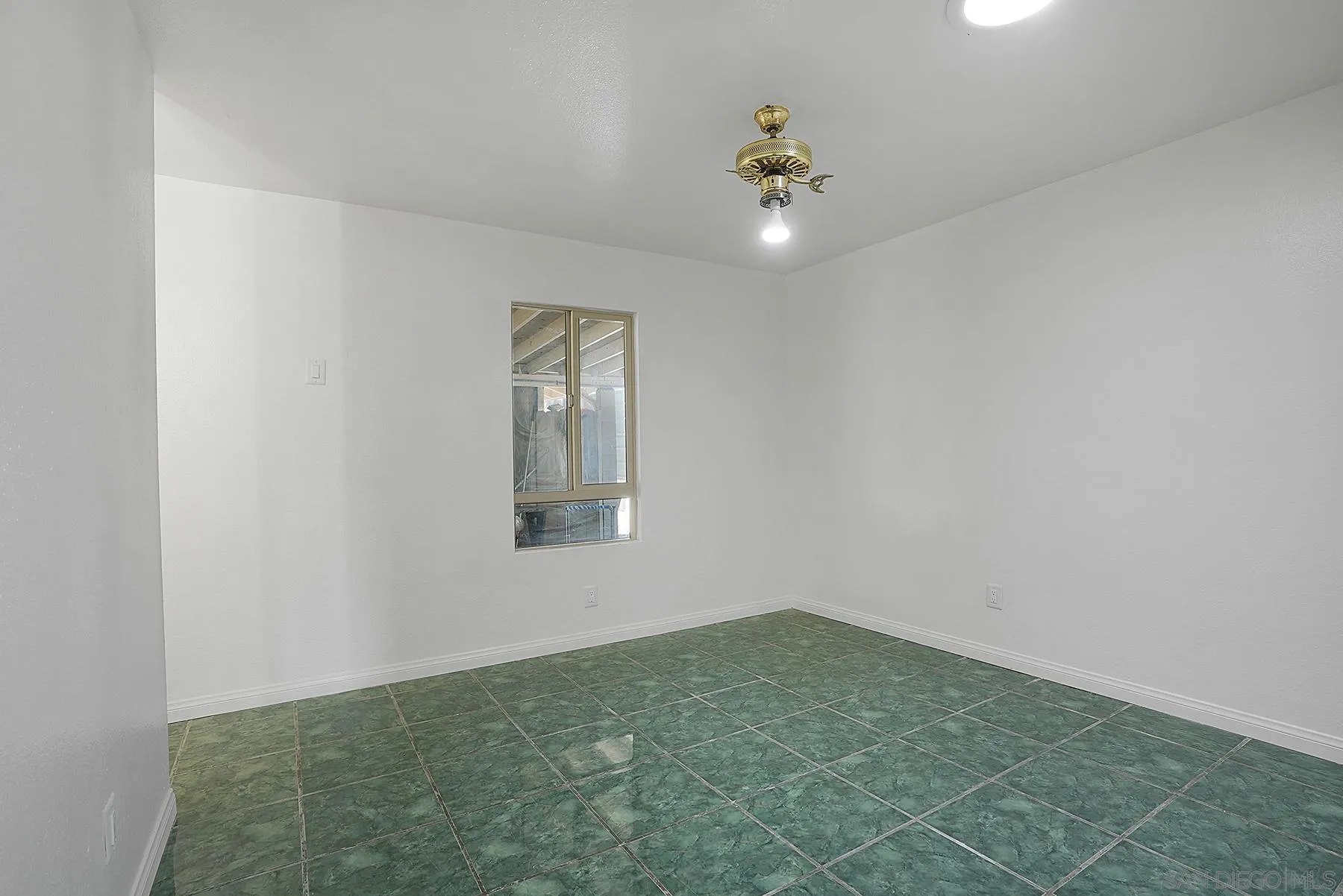 9820 St George Street Spring Valley, CA 91977 - Photo 9 of 23 a view of an empty room with a window