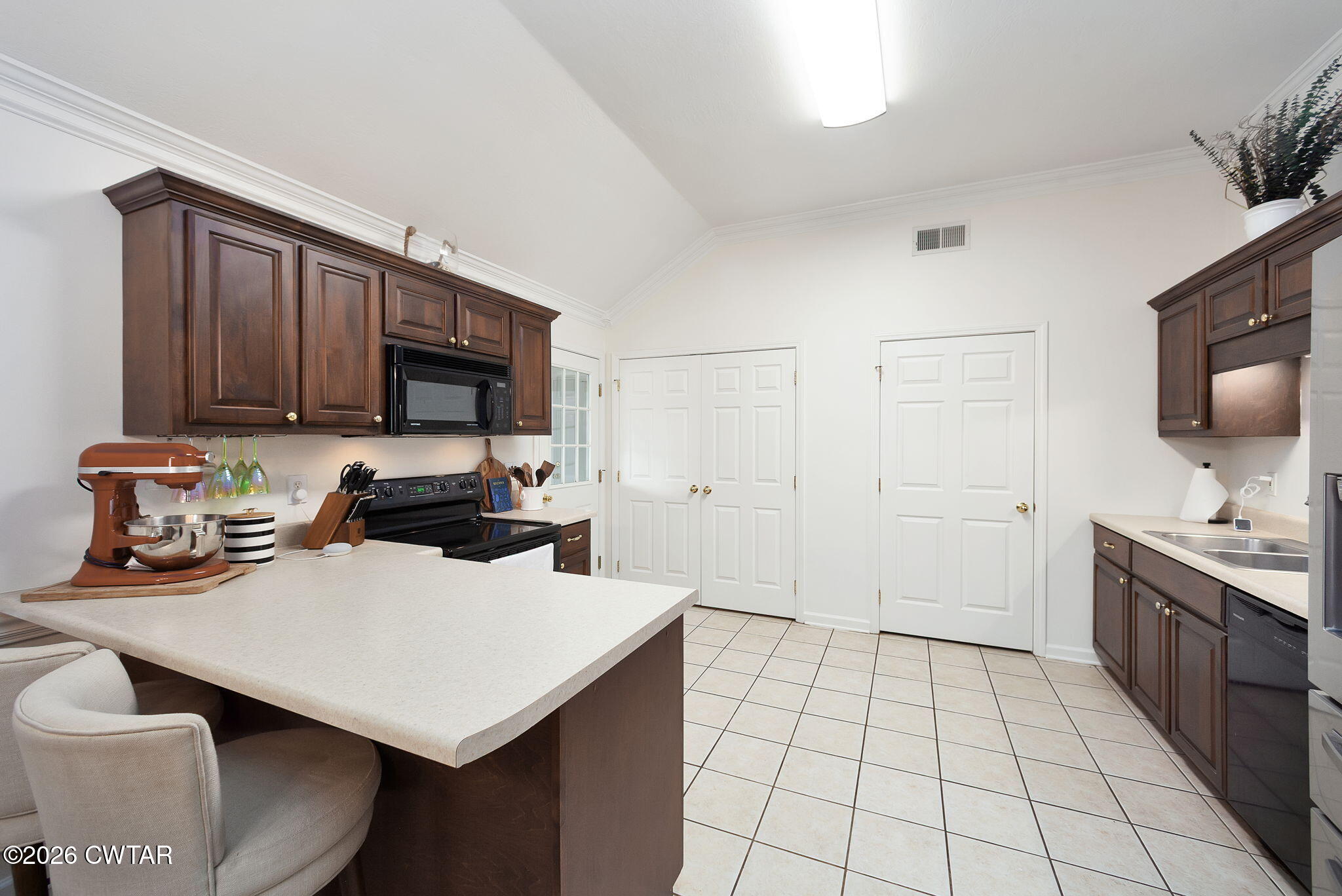 80 Rooker Drive Jackson, TN 38305 - Photo 11 of 30 a kitchen with a sink a stove and cabinets