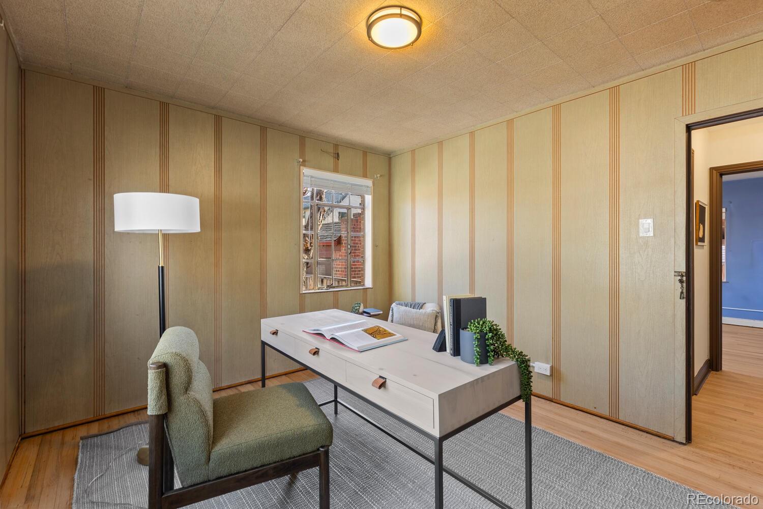 390 Dexter Street Denver, CO 80220 - Photo 20 of 30 a view of a workspace with furniture and wooden floor