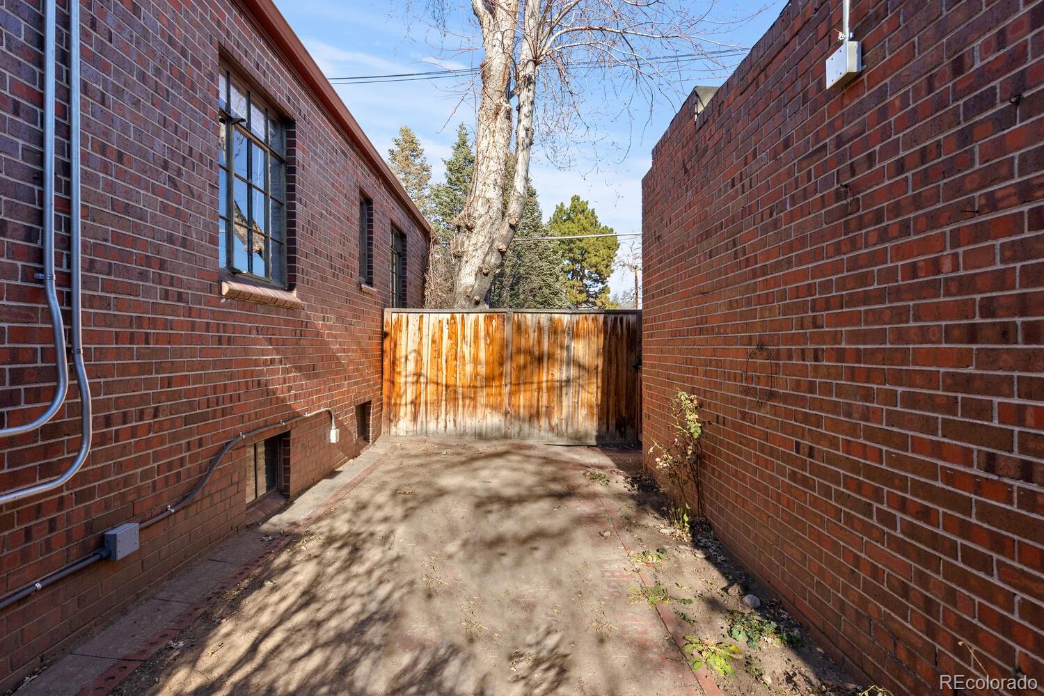 390 Dexter Street Denver, CO 80220 - Photo 23 of 30 a view of a pathway both side of building