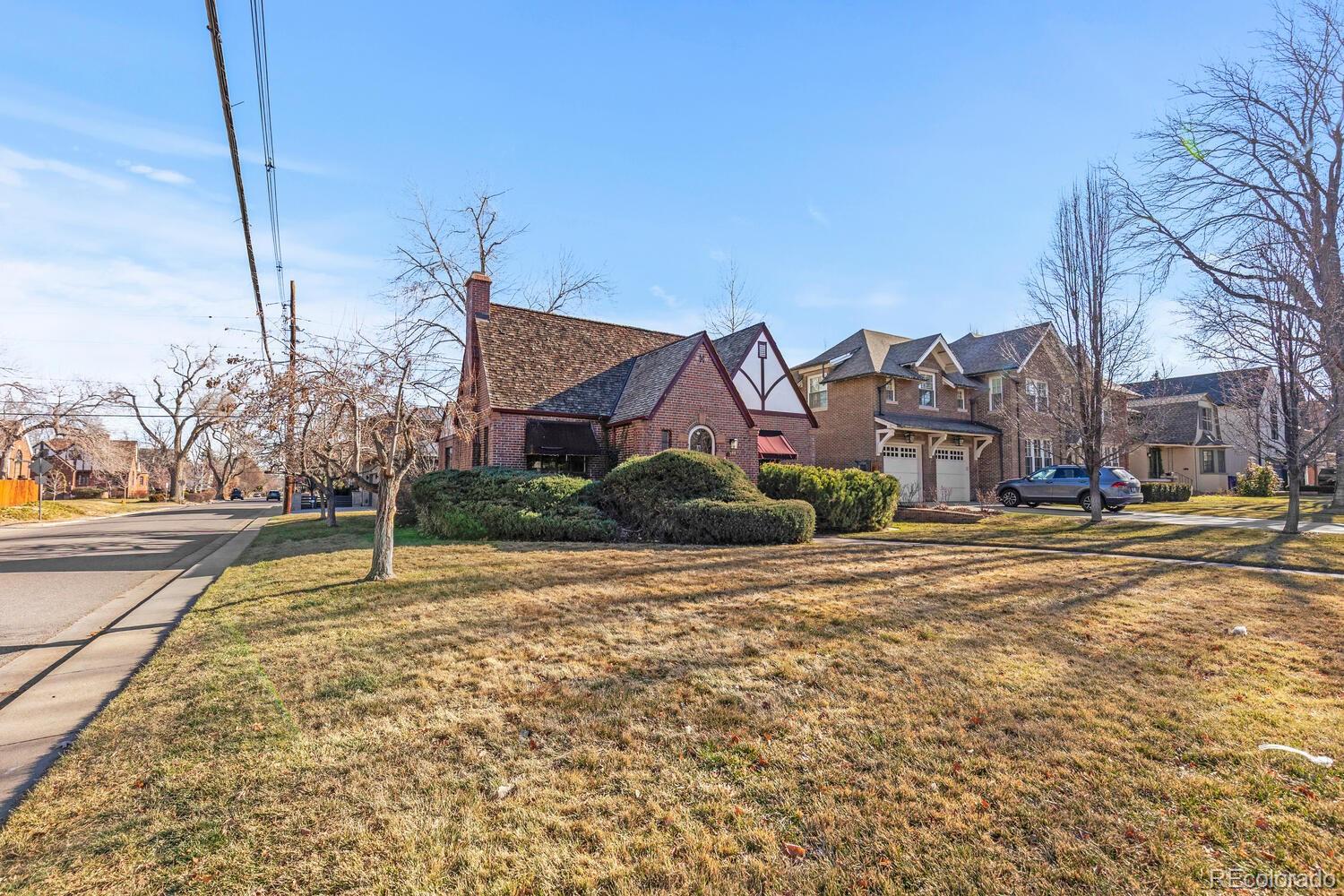 390 Dexter Street Denver, CO 80220 - Photo 27 of 30 a view of a house with a yard and trees