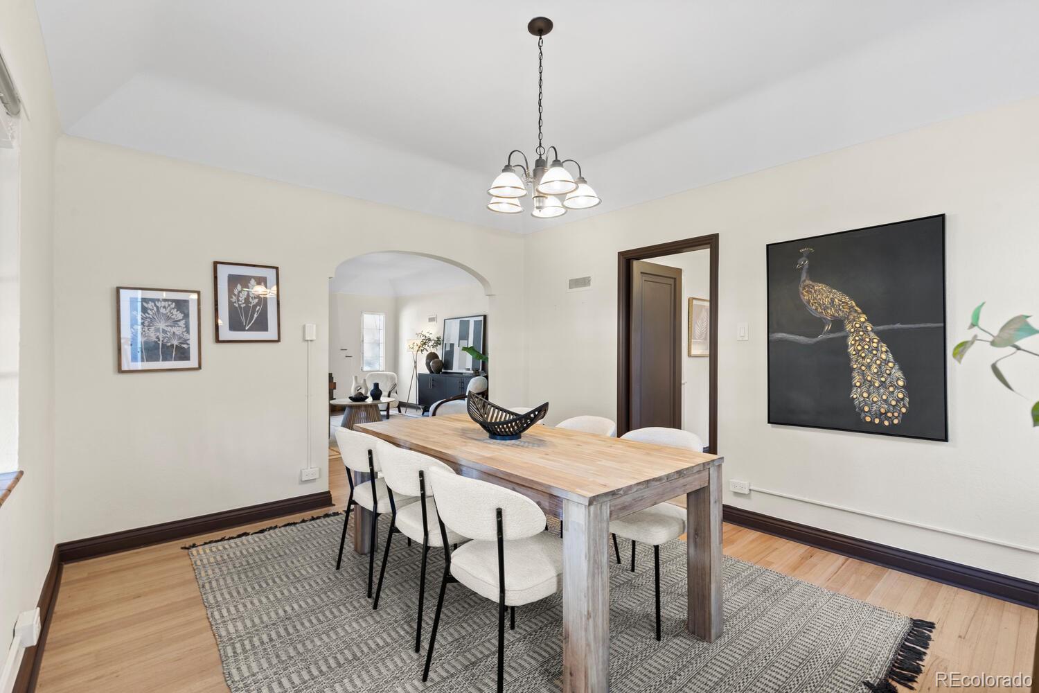 390 Dexter Street Denver, CO 80220 - Photo 10 of 30 a view of a dining room with furniture and wooden floor