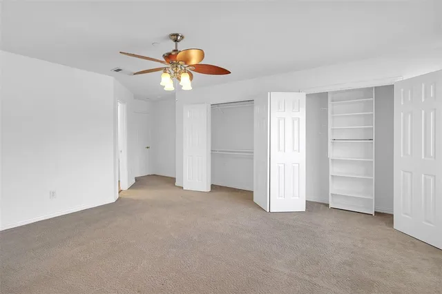 a bathroom with a granite countertop sink mirror and bathtub