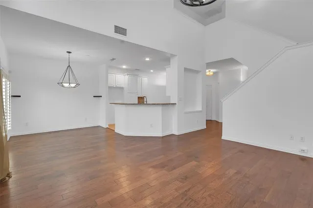 a view of a kitchen with a sink and a window