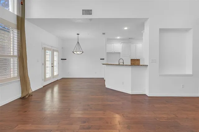 a view of a kitchen with a sink and cabinets