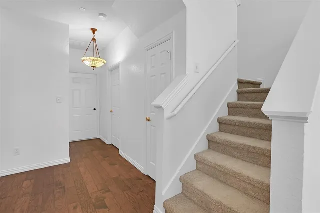 a view of staircase with white walls