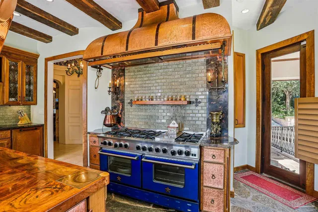 a bedroom with furniture and a chandelier