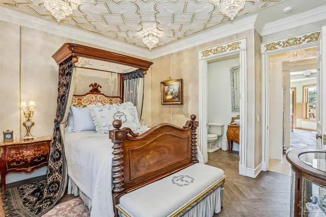 a living room with furniture and a large windows