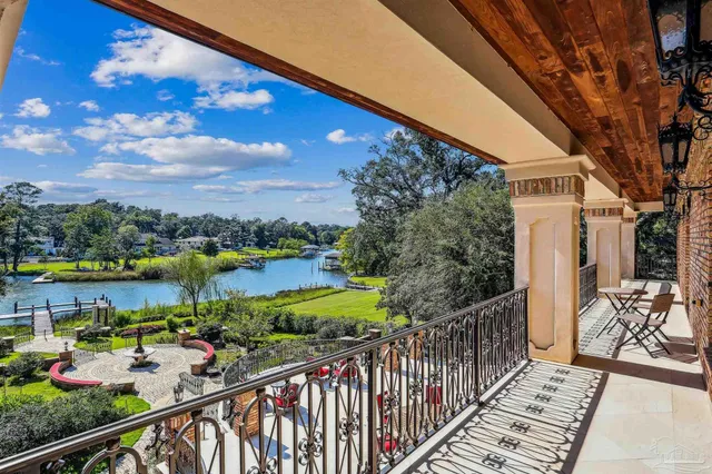 an aerial view of a house with a lake view