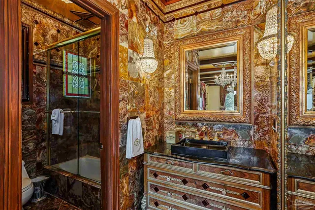 an aerial view of a house with a yard basket ball court and outdoor seating