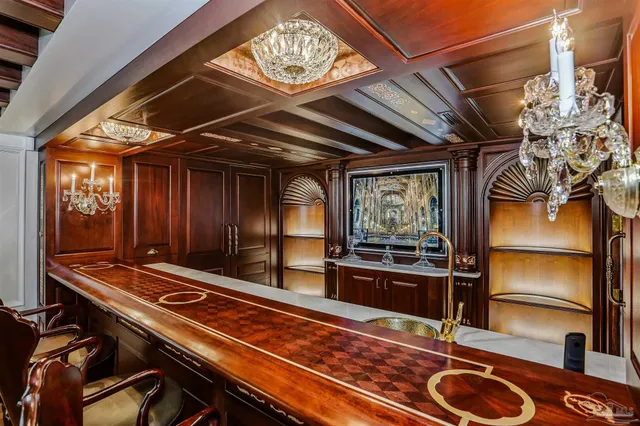 an aerial view of residential houses with outdoor space and swimming pool