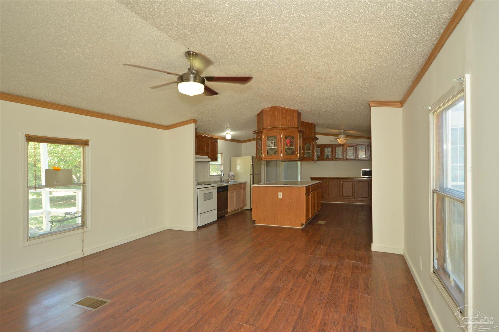 4401 B B Lowery Road Milton, FL 32583 - Photo 6 of 37 leads to kitchen w/ island
